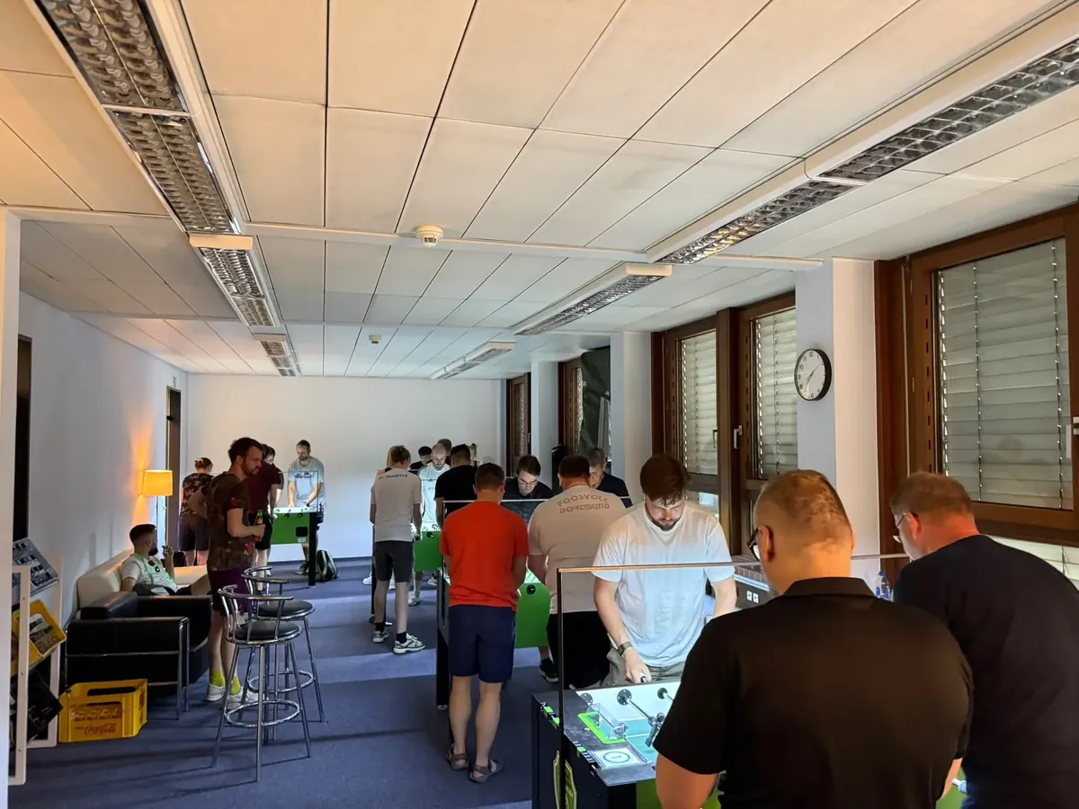 A busy evening at TFC Osnabrück with several foosball tables in use
